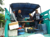 Hitchhiking in Sumbawa, women going back home after selling their fish
