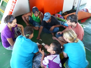 Playing yatzi with locals in the ferry from Sape to Labuan Bajo!