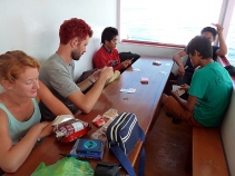 Playing cards with locals on the way to the Togean Islands